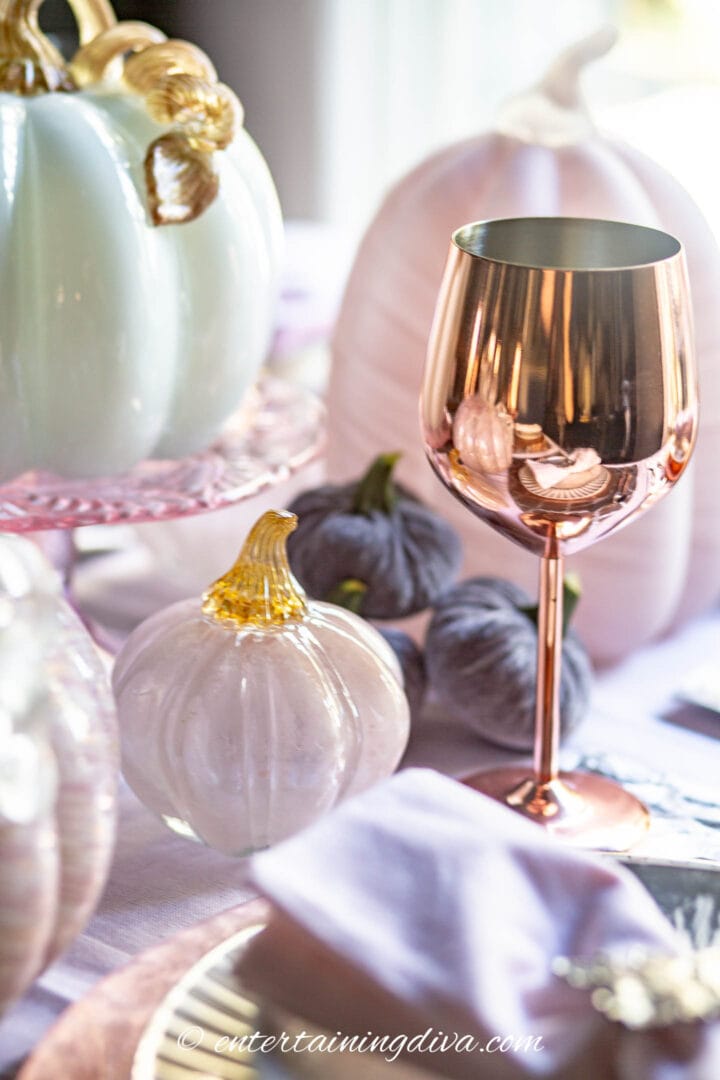 Copper wine glass with pink pumpkin centerpiece