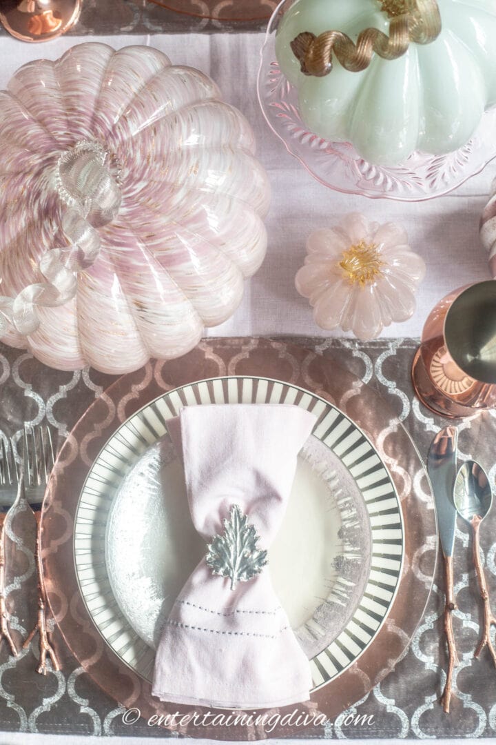Pink and silver fall table setting with pink pumpkins