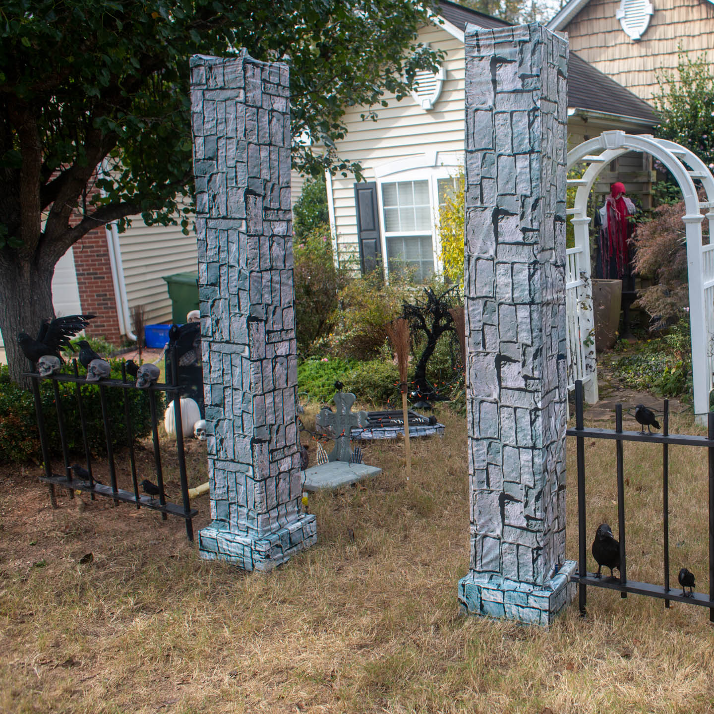 DIY stone pillars at the entry to a Halloween cemetery