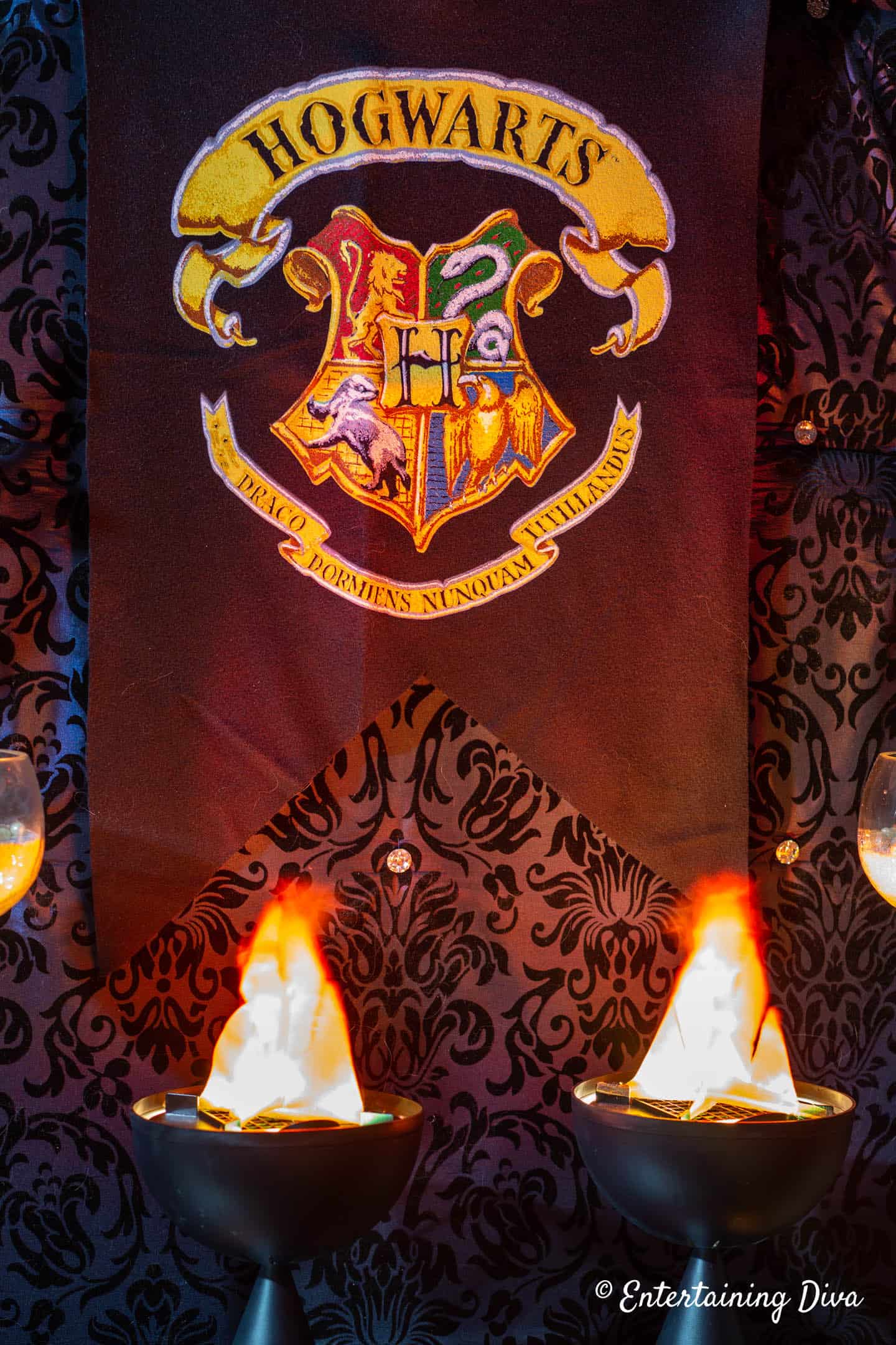 Hogwarts banner with flames beneath it
