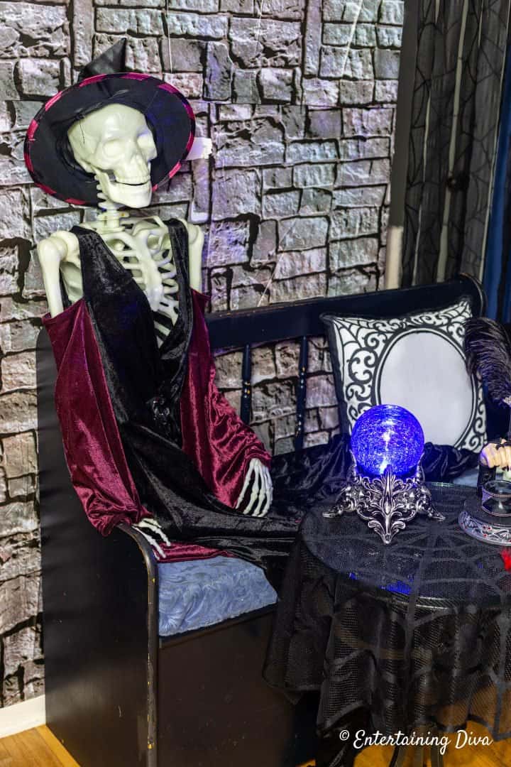 Halloween party coat check attendant witch skeleton