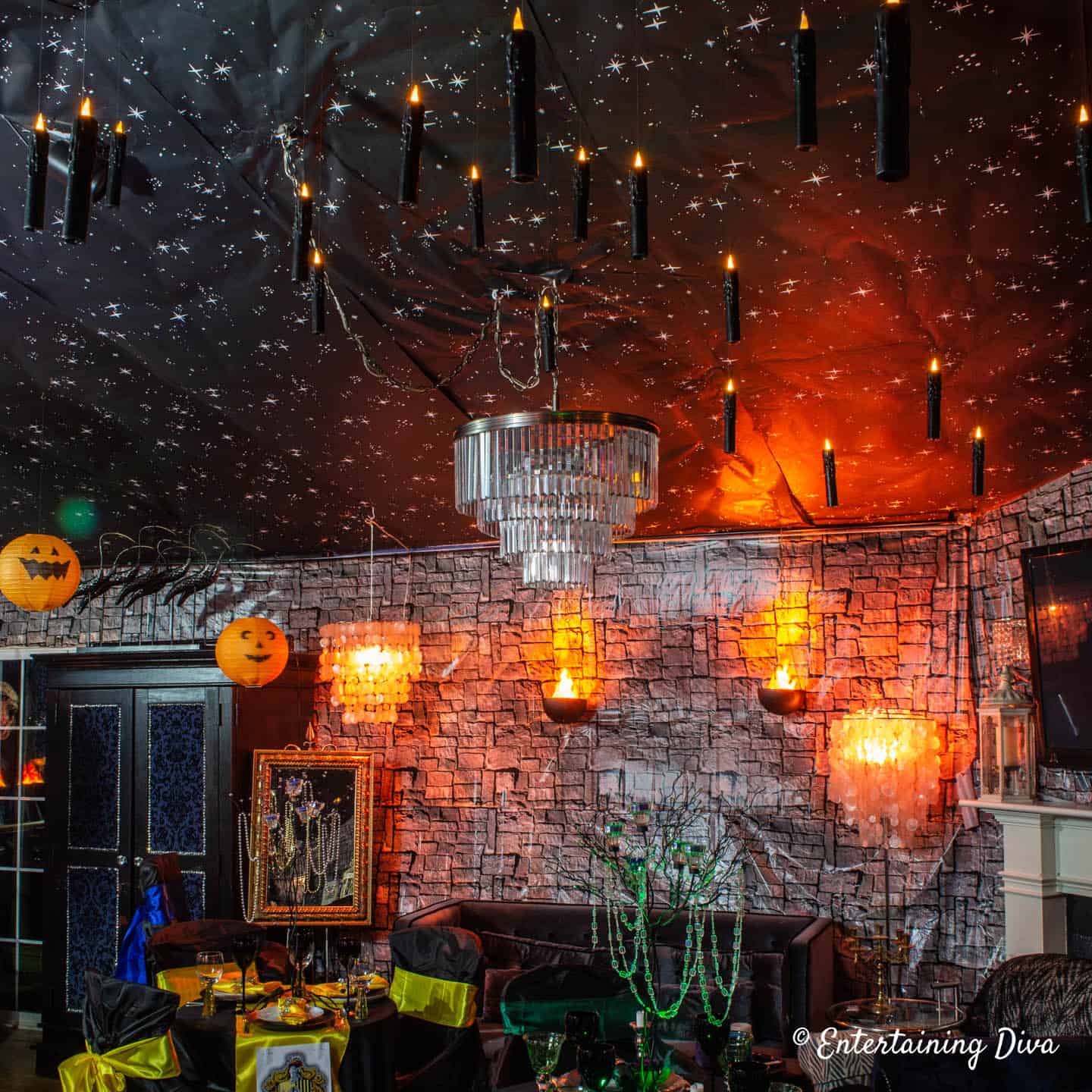 Harry Potter Halloween party decor with fake candles hung from the ceiling