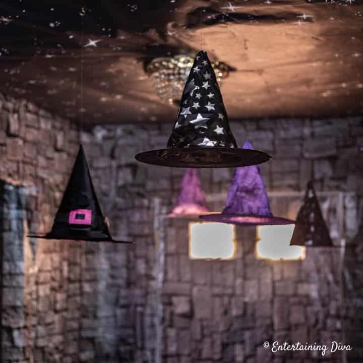 DIY floating witch hats used as hanging decorations at a Harry Potter party
