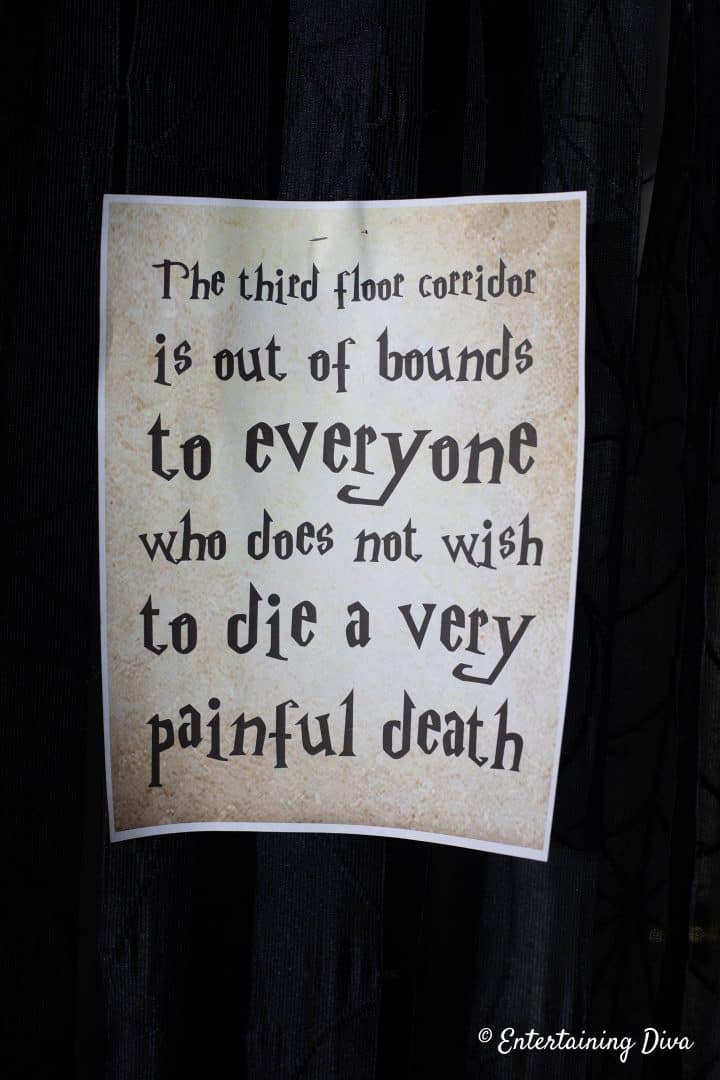 A Harry Potter printable sign that says "The third floor corridor is out of bounds to everyone who does not wish to die a very painful death"
