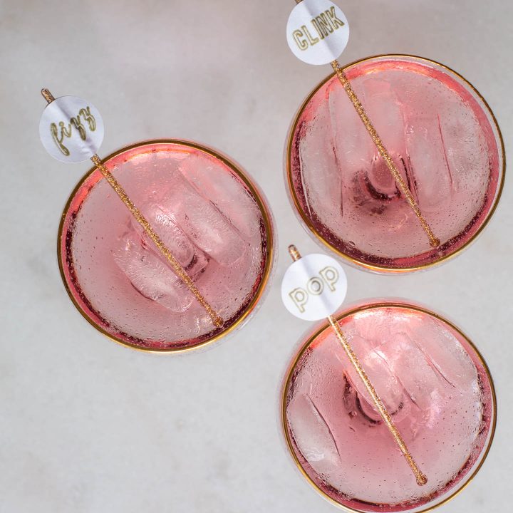 Pop, Fizz, Clink drink stirrers in champagne cocktails