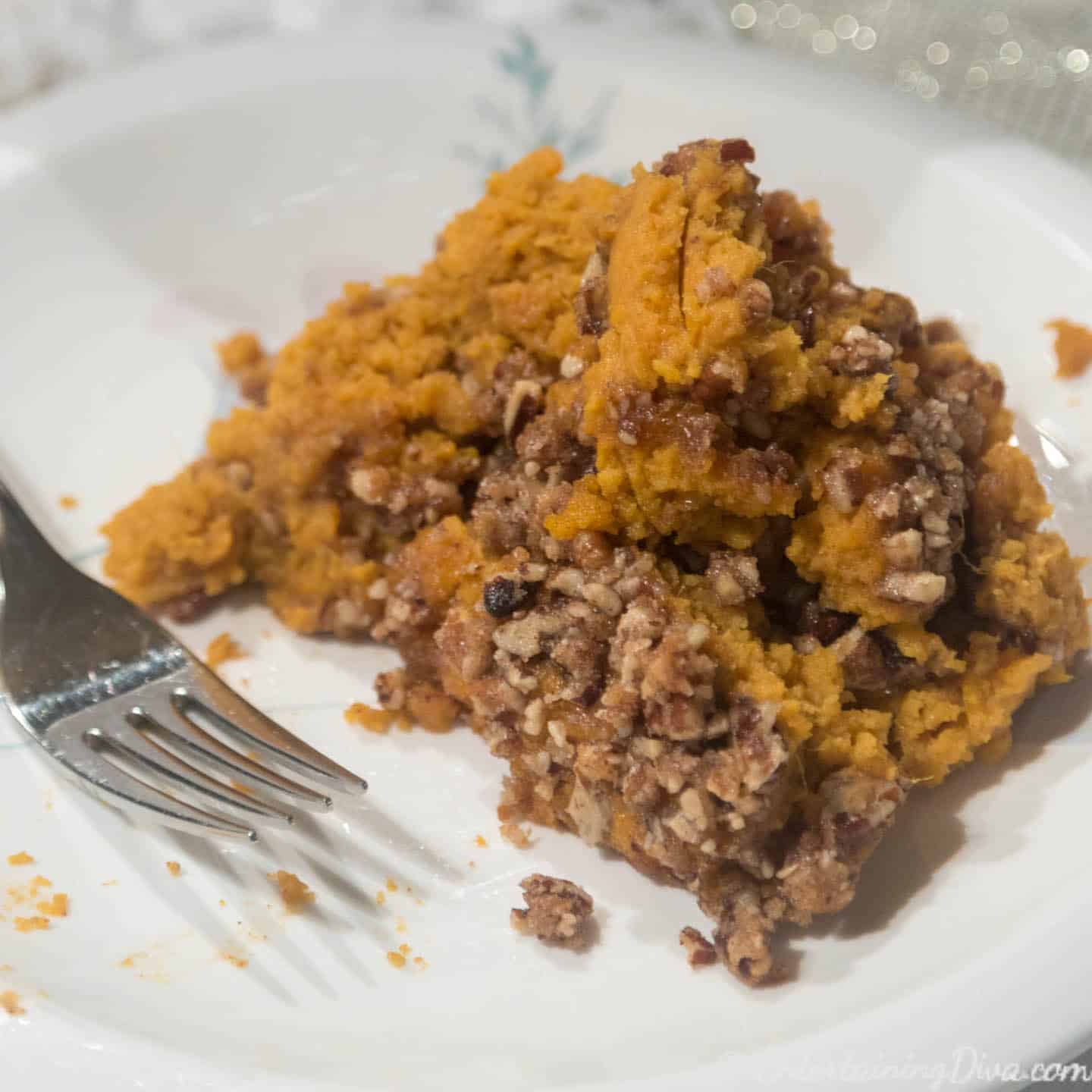 Crockpot sweet potato casserole with pecans on a plate