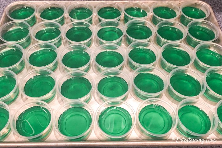 Blue Curacao and Tequila Margarita jello shots in jello shot cups on cookie sheet