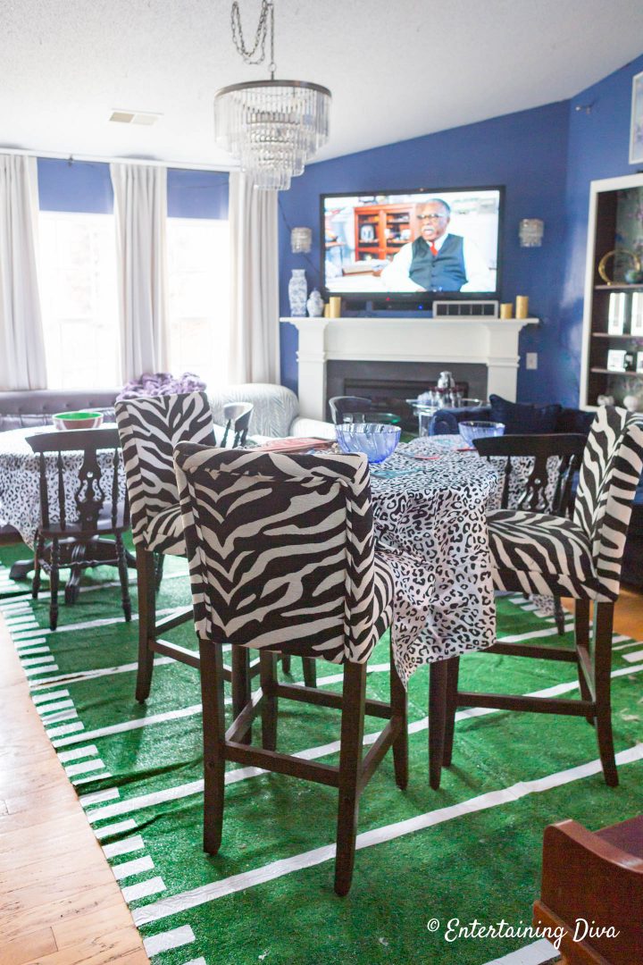 DIY football field area rug in the living room with the other super bowl party decorations