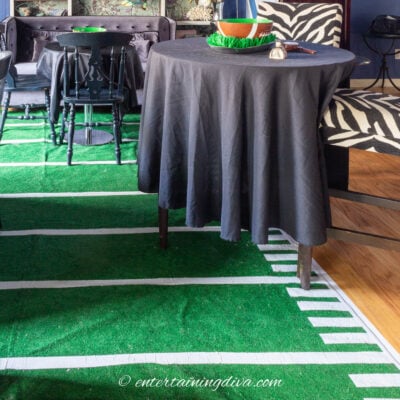 DIY football field rug on the floor at a Super Bowl party