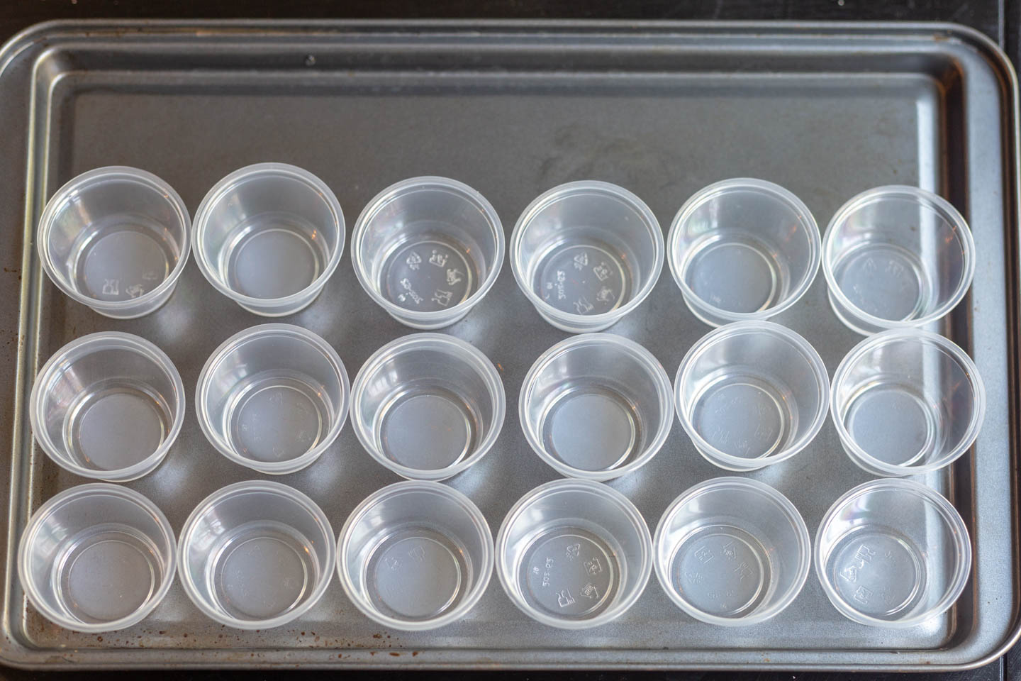 jello shots cups on a cookie sheet