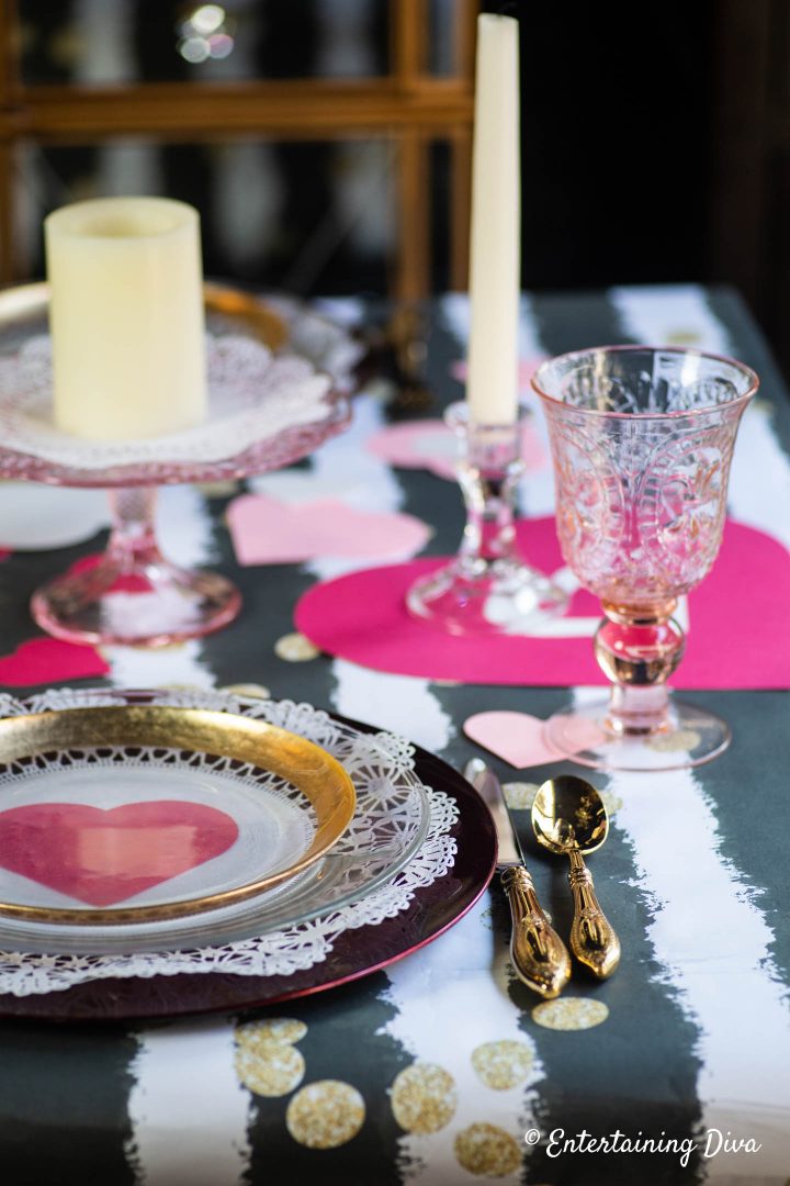 Valentine day table setting with pink water goblets