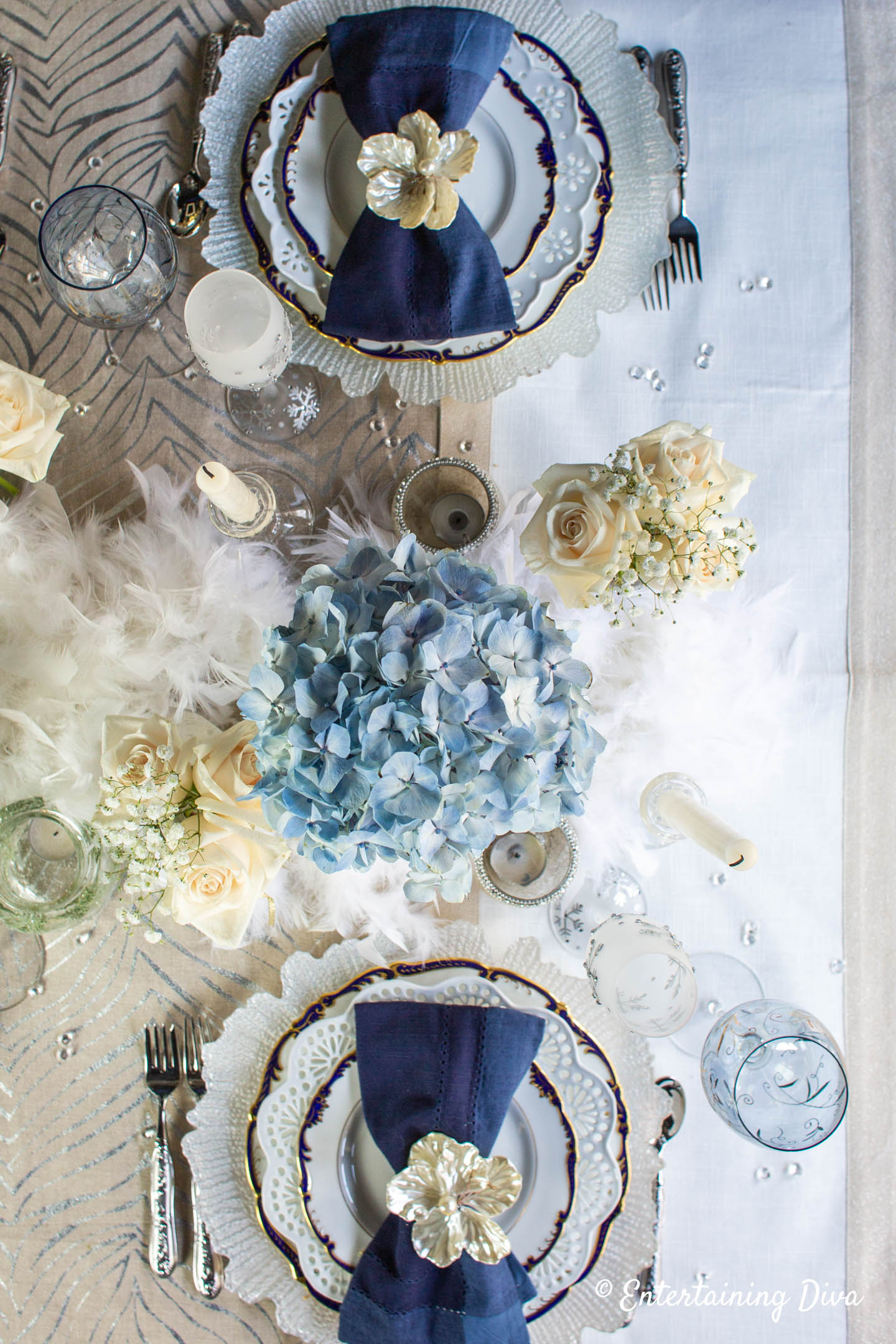 Winter wonderland table decor with place settings and flowers