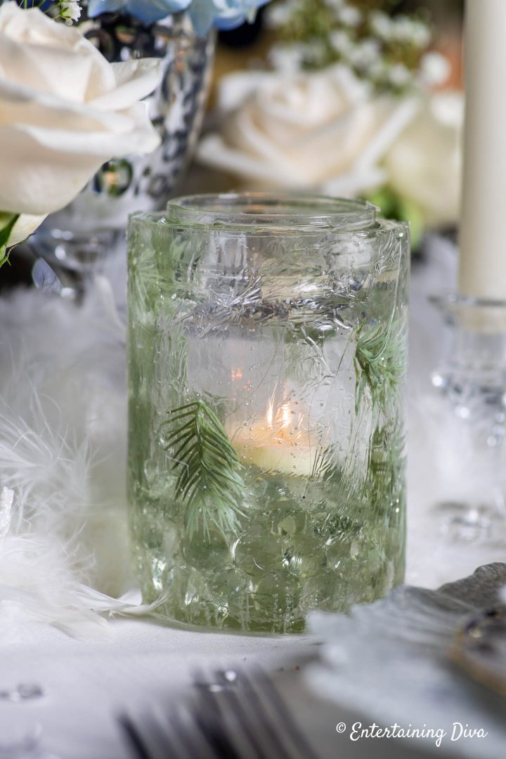 DIY ice candle holder with evergreens made from a mason jar