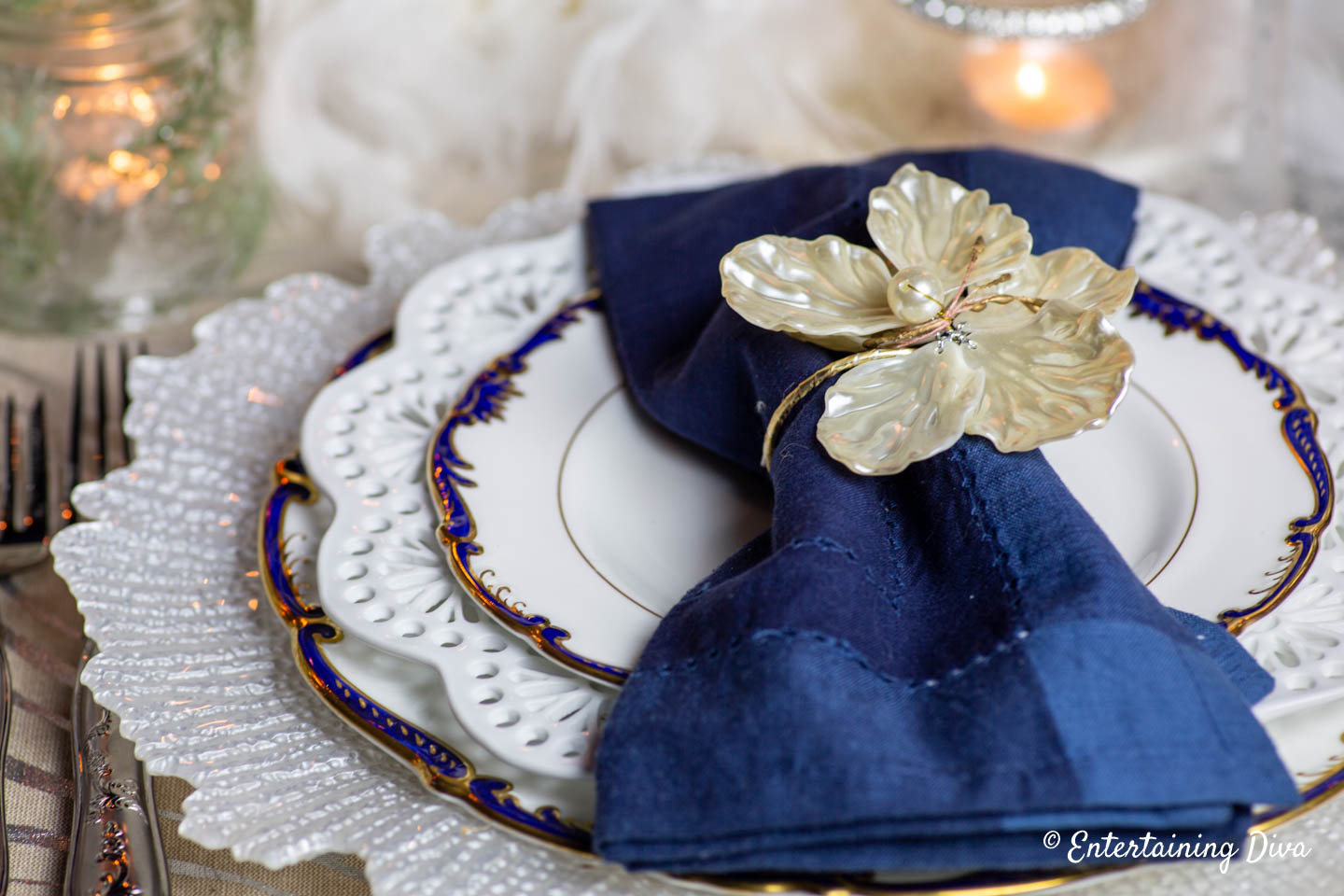 White, blue and gold place setting as winter wonderland table decor