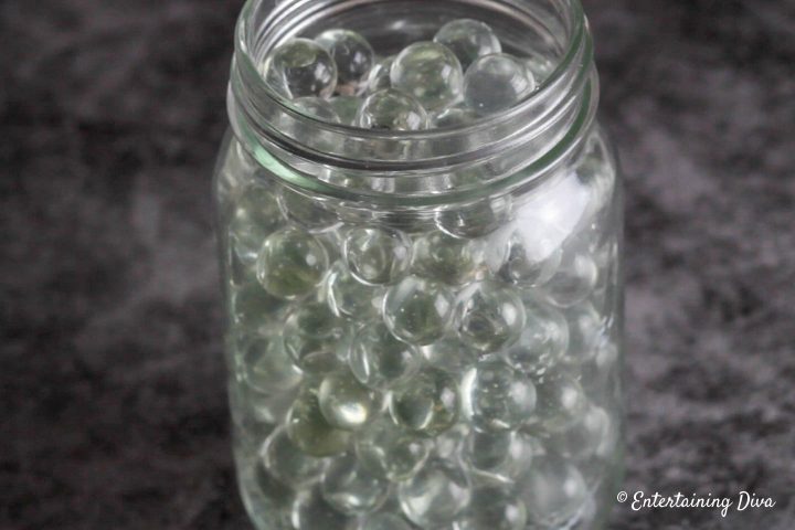 Fill the mason jar with marbles