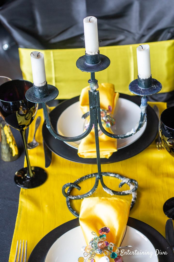 Black candelabra used as the centerpiece for Hufflepuff table