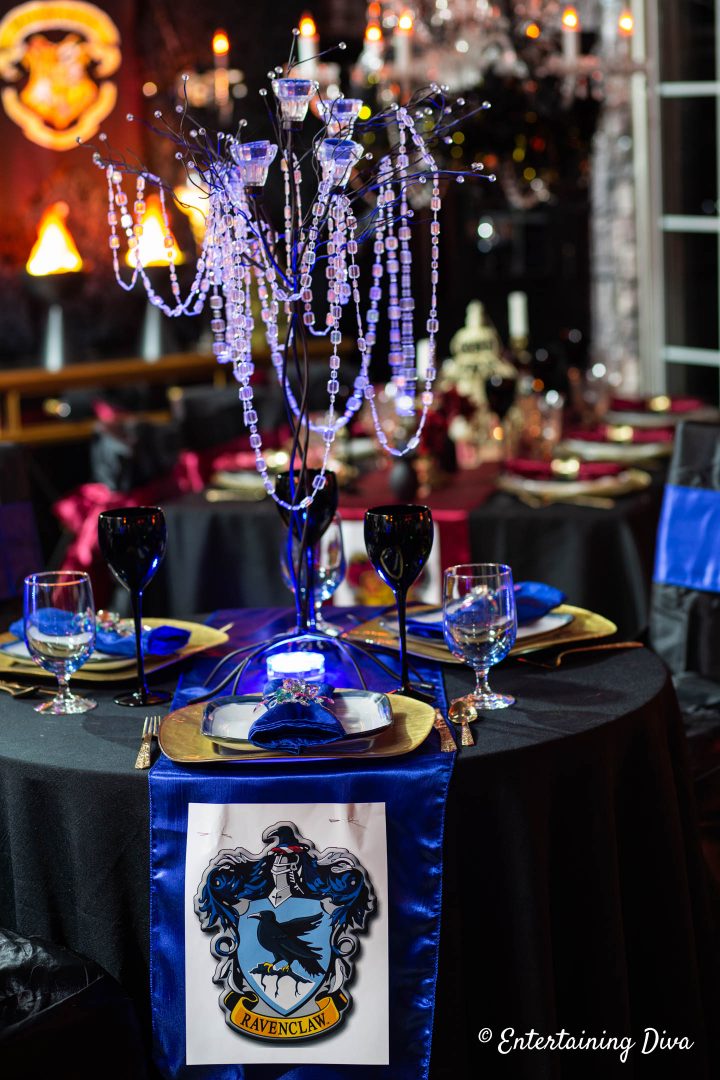 Ravenclaw table centerpiece made with a candle tree uplit in blue