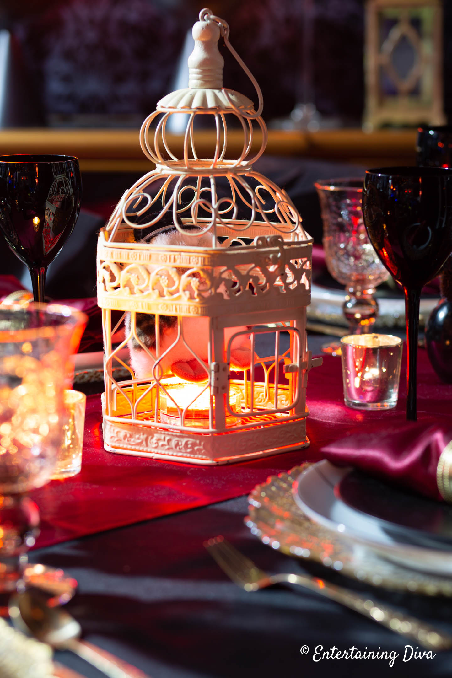 Harry Potter table centerpiece with Hedwig stuffed owl in a white bird cage