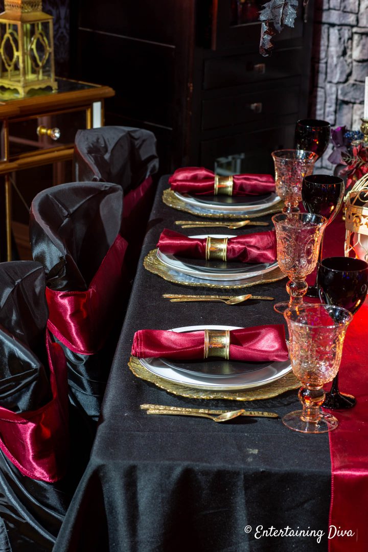 Red, gold and black place settings on the Gryffindor table