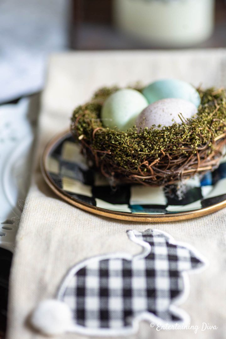 Easter egg nest on top of appetizer plate and napkin