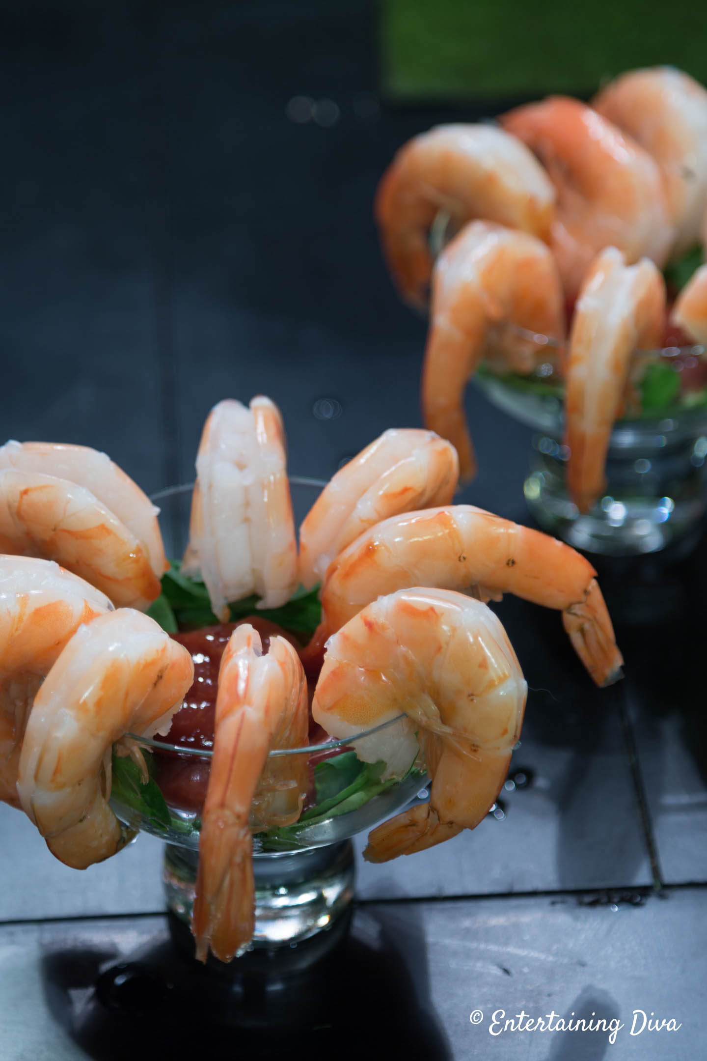 Classic Shrimp Cocktail with seafood sauce served in cocktail glasses