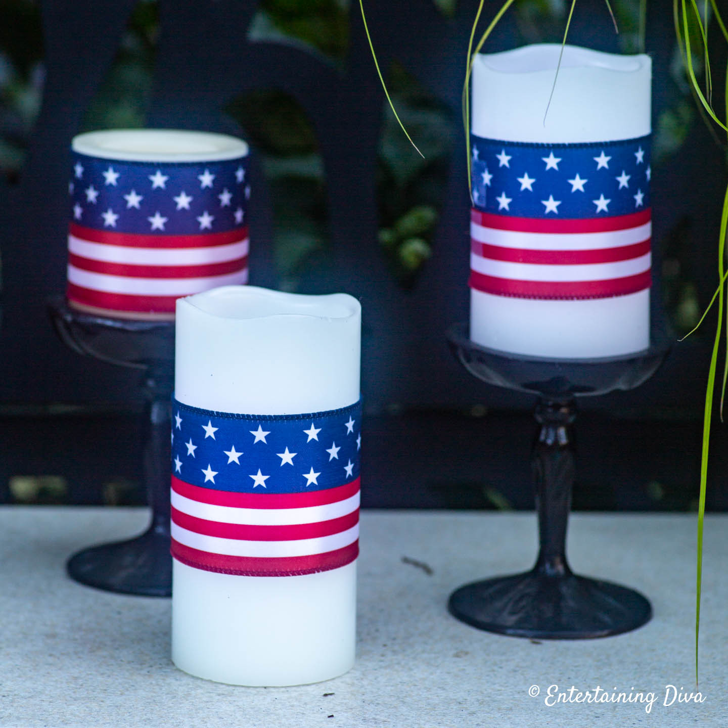 Red, white and blue ribbons wrapped around pillar candles for the 4th of July