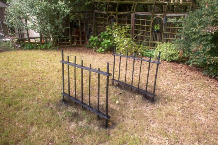 The DIY Halloween cemetery picket fence spray painted black
