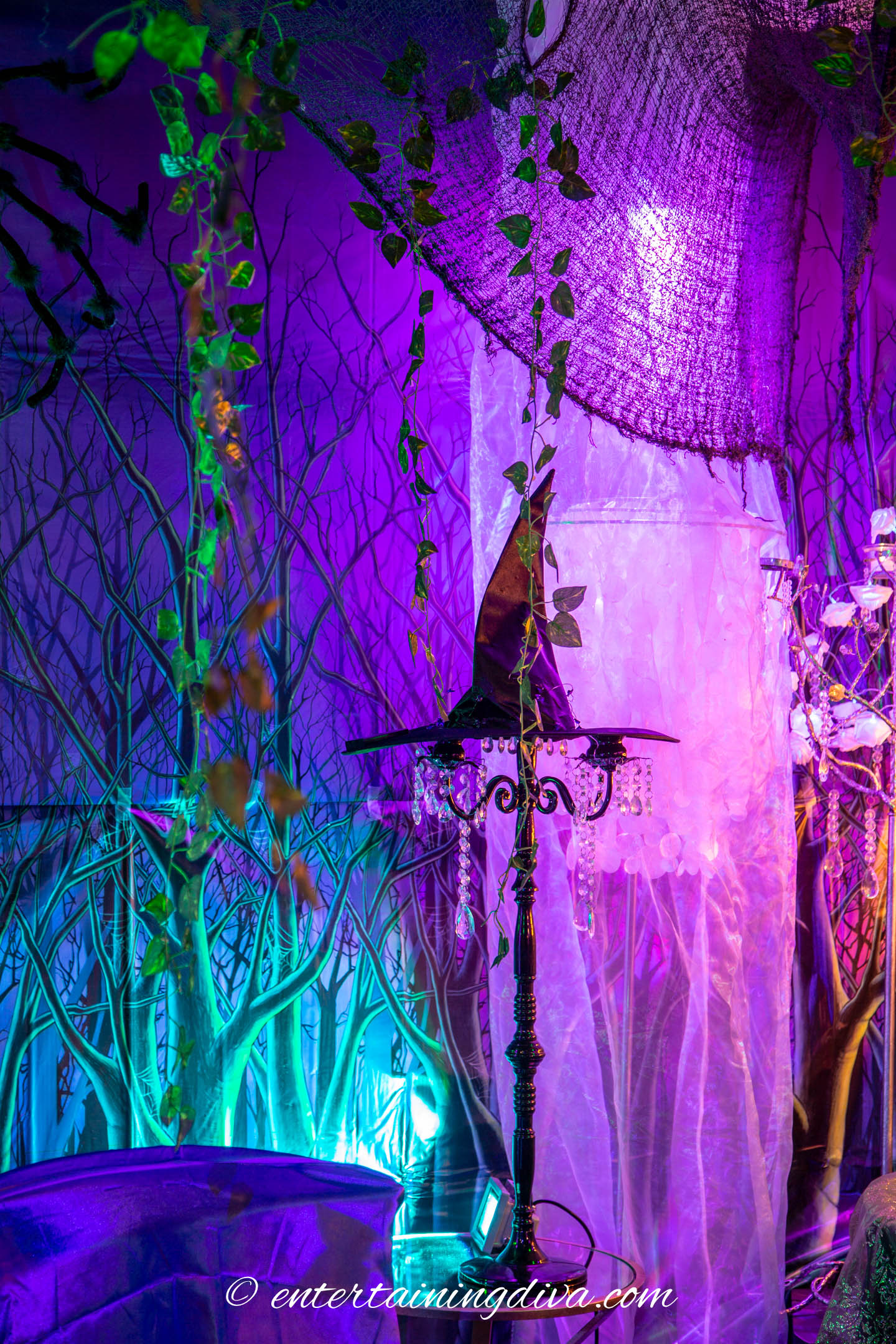 Faux tree trunks made from chiffon fabric and disco ball lights