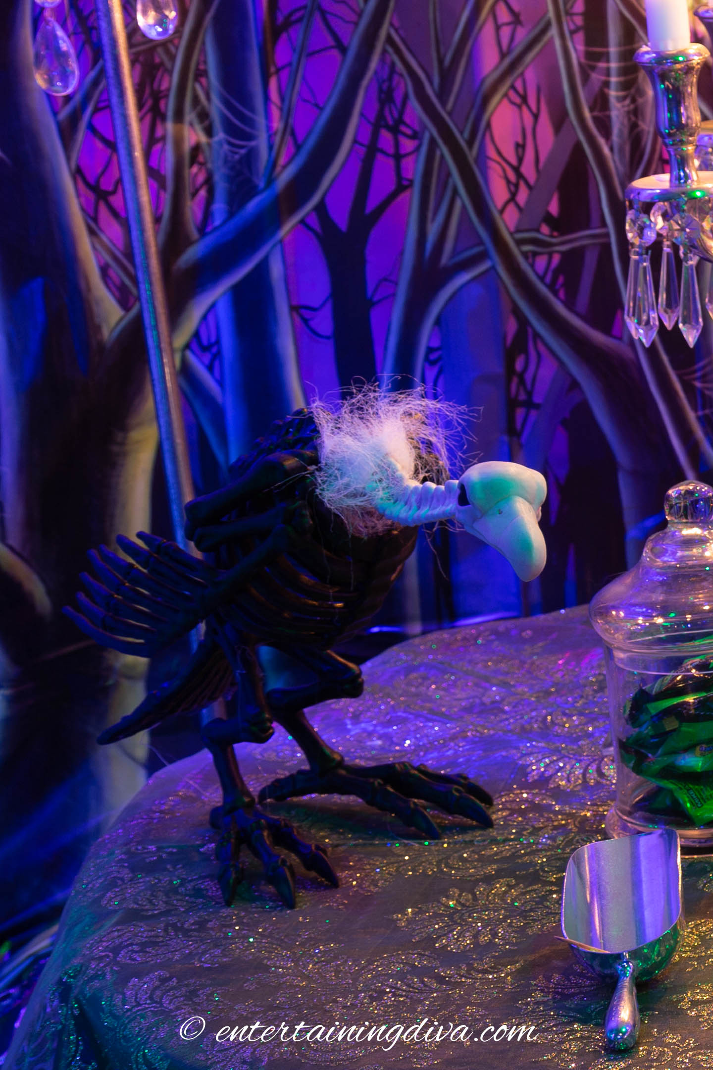 Maleficent party decor with a buzzard on a table