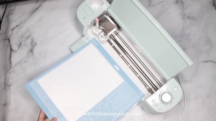 Loading white paper on a light grip Cricut mat