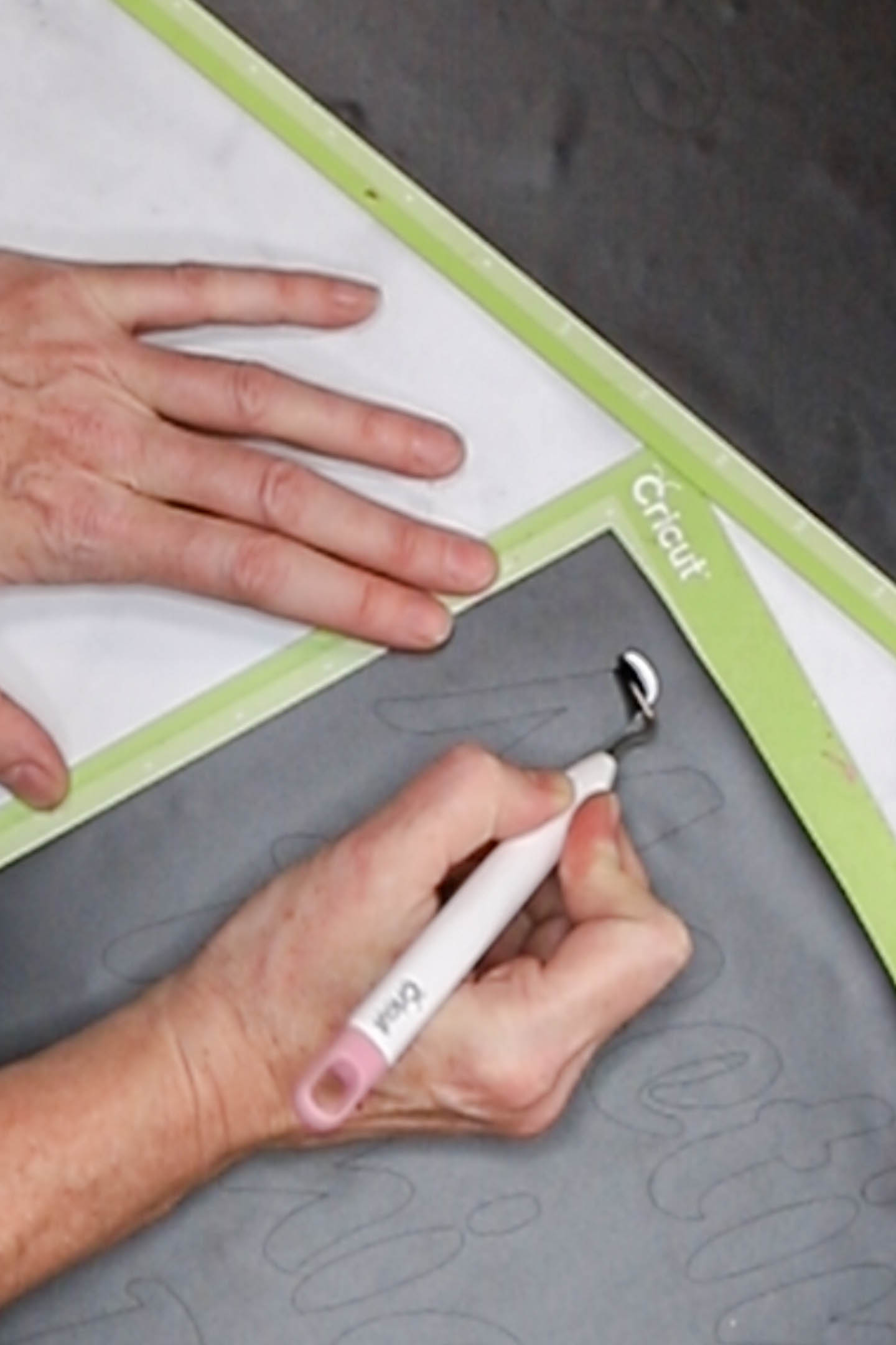 Removing vinyl letters with Cricut weeding tool