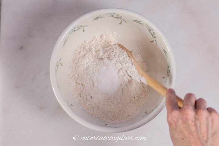 All the dry ingredients for maple pecan scones in a bowl