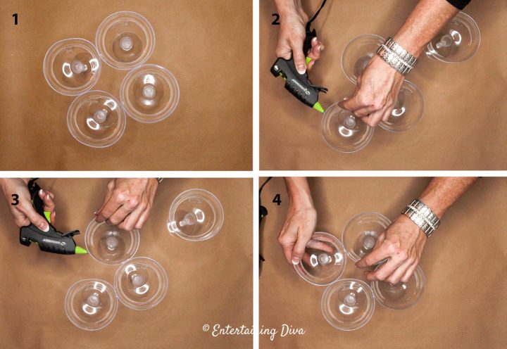 Hot glue the edges of the champagne glasses together