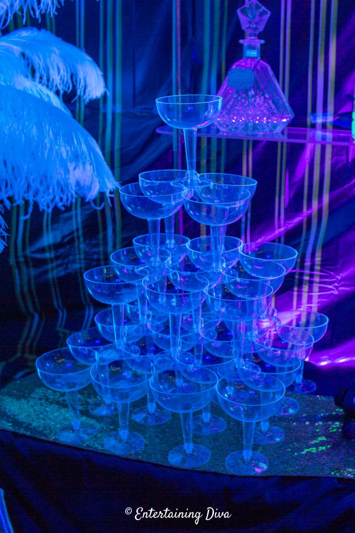 The DIY champagne glass tower under black lights