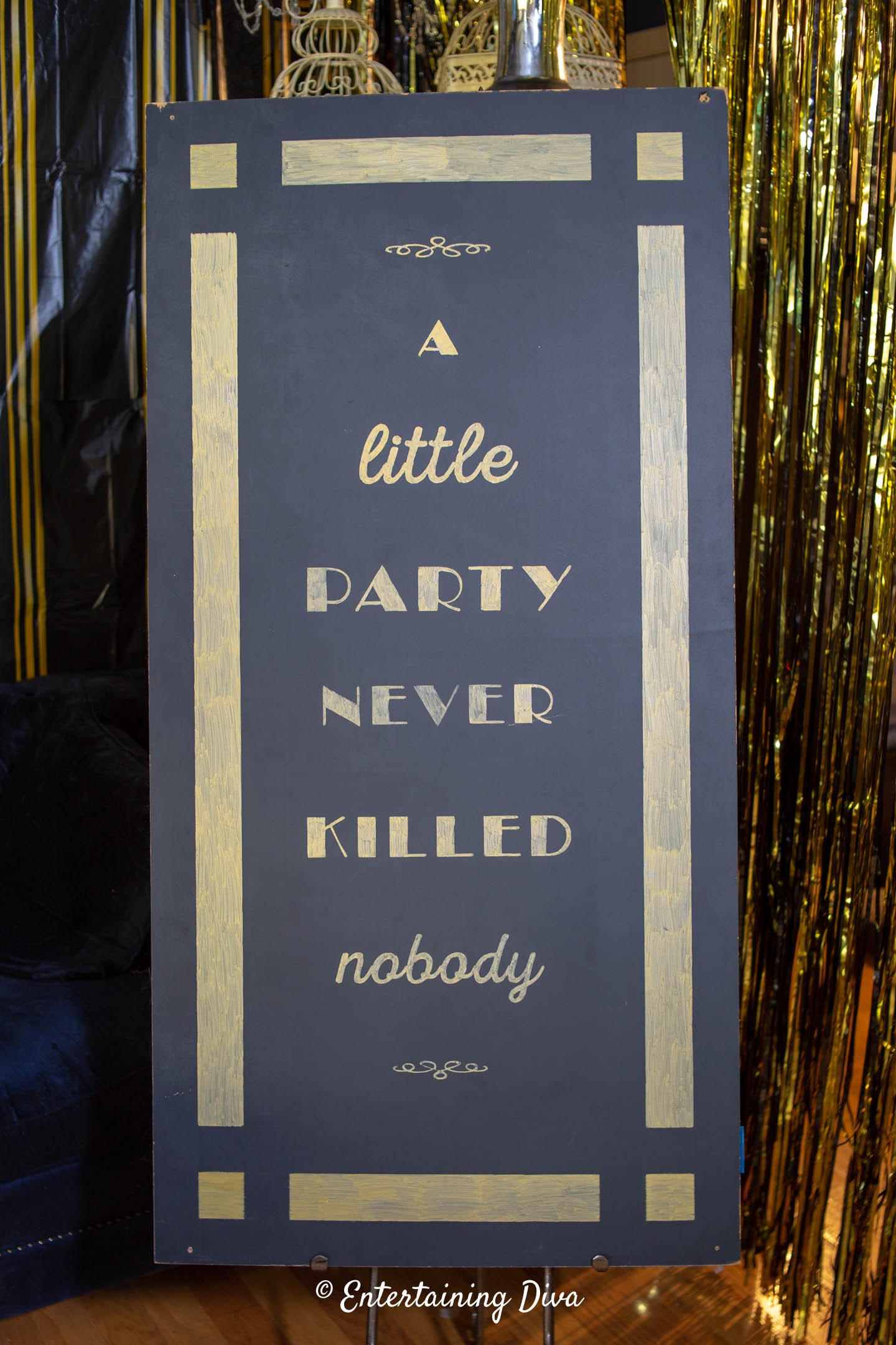 DIY Gatsby blackboard sign that says "A little party never killed nobody"