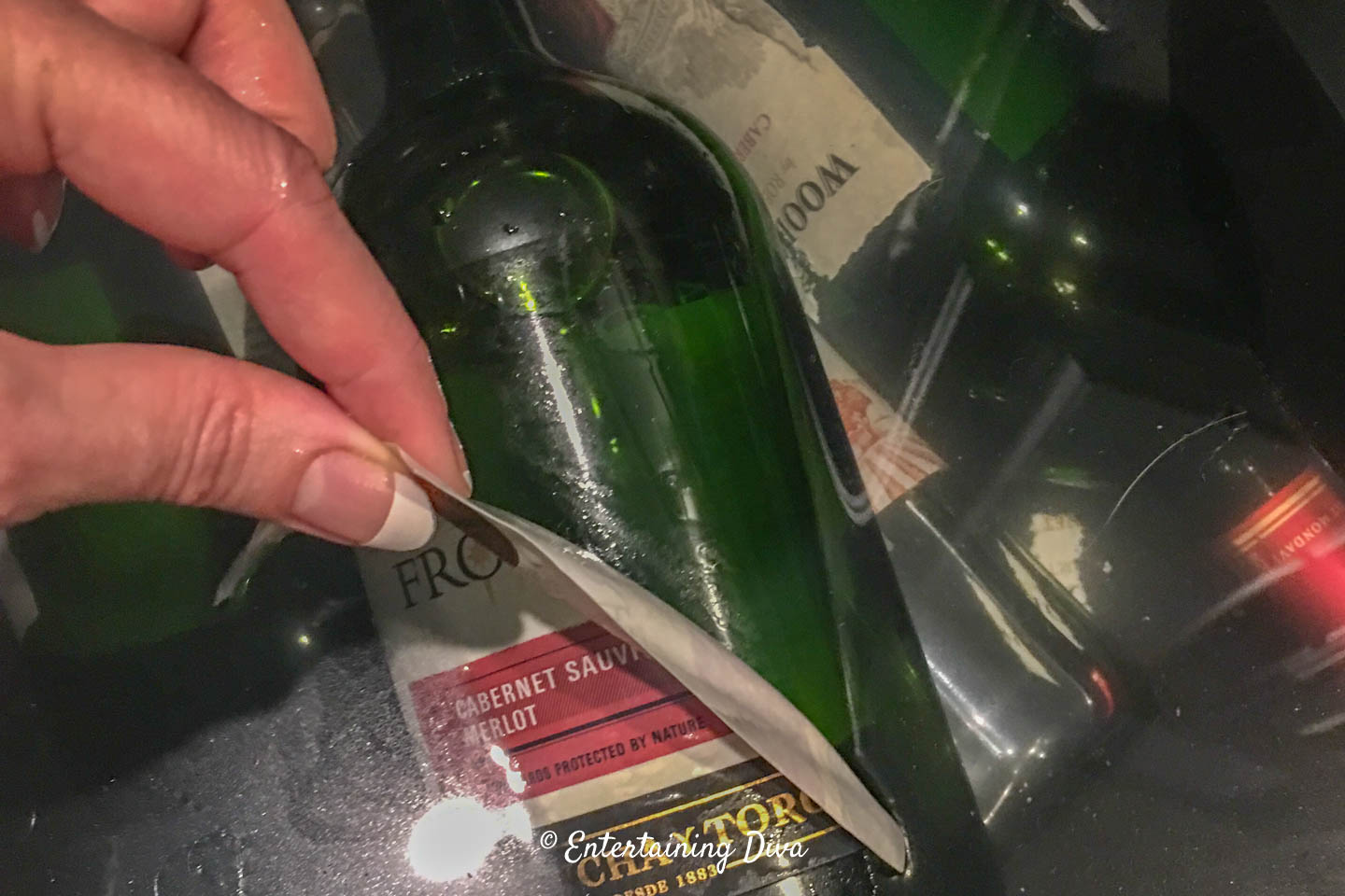 Peeling the labels off the bottles