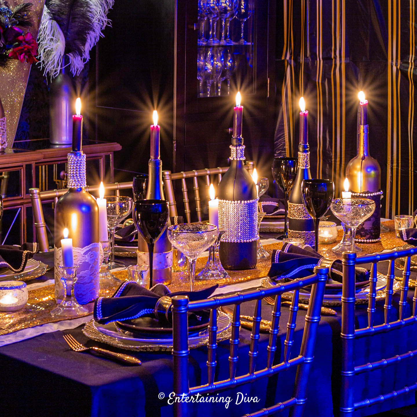 DIY wine bottles used as candle holders in a centerpiece on a Great Gatsby party tablescape