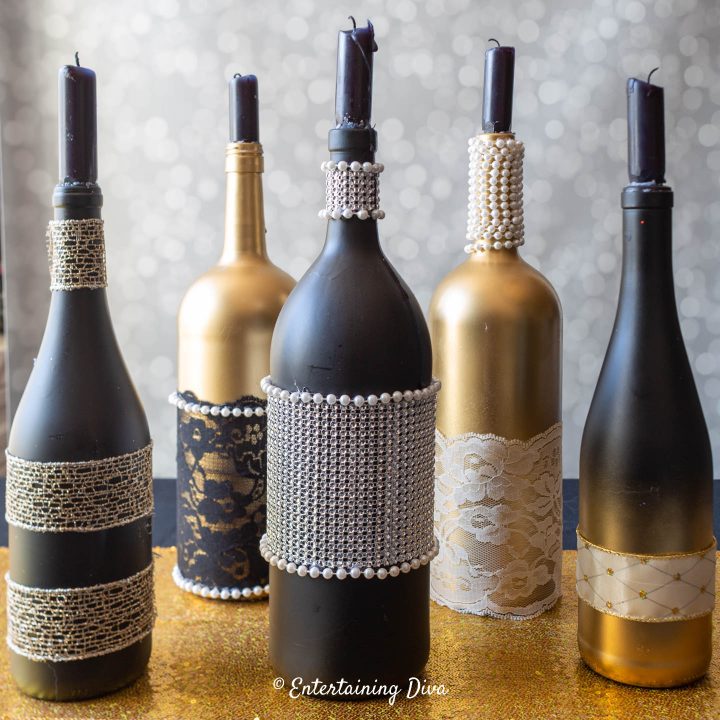 The finished DIY wine bottle centerpieces with candles