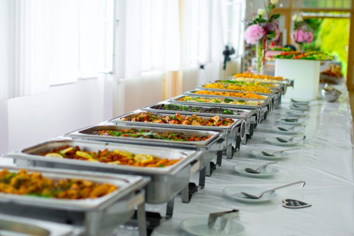 Long line of chafing dishes against the wall