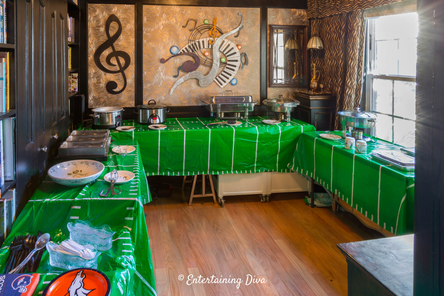 U-shaped buffet tables set up with different food stations