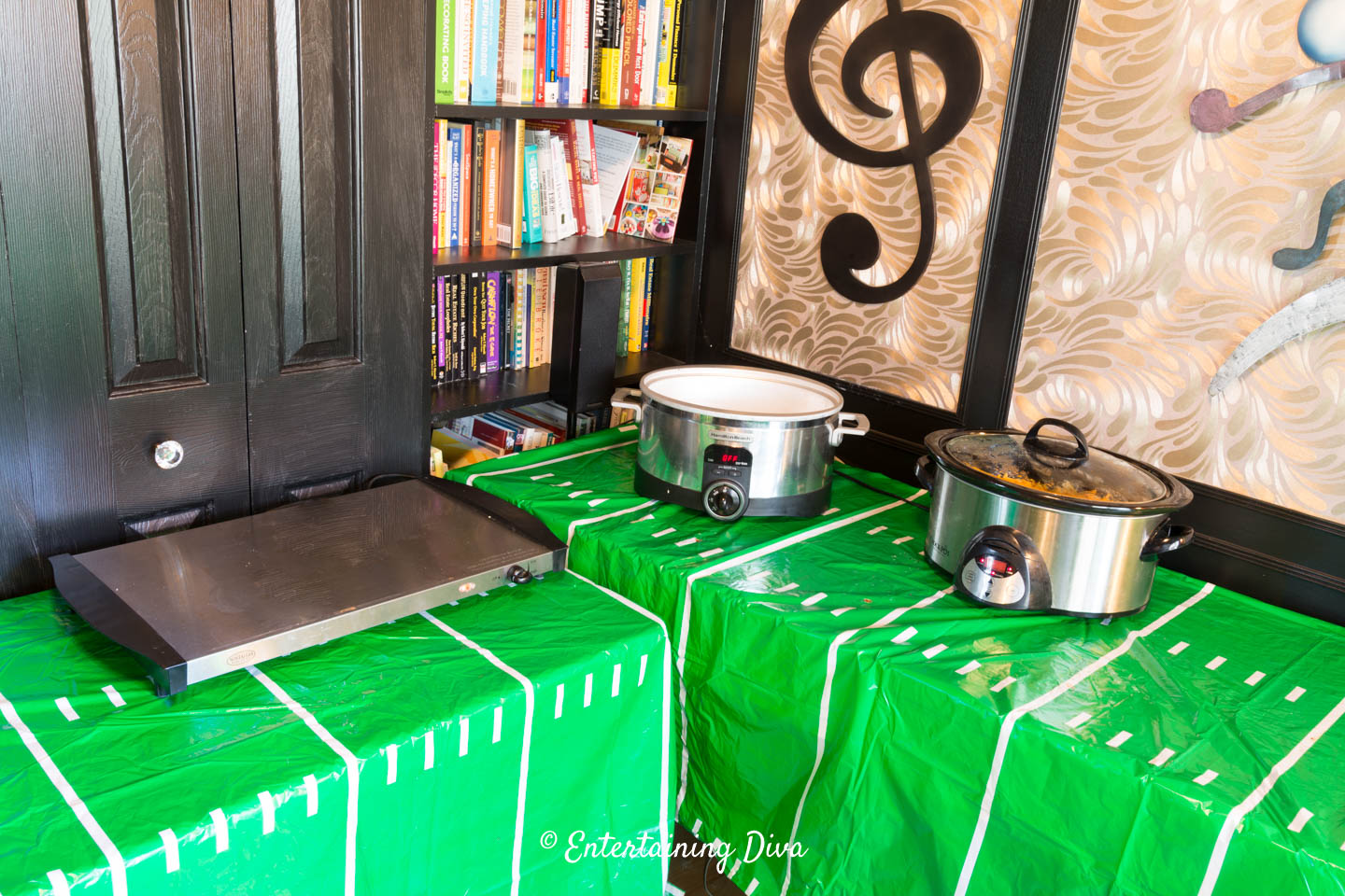 Warming plate and crock pots plugged in on the buffet