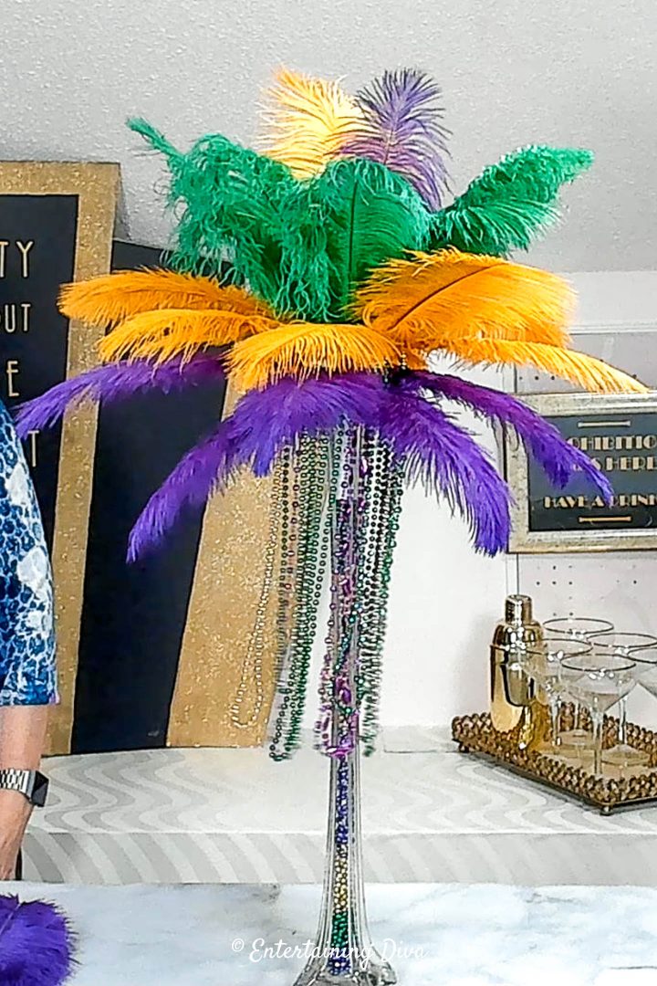 The finished DIY Mardi Gras feather centerpiece