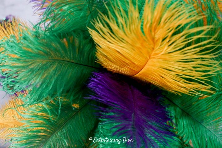 Purple and gold ostrich feathers added to the top of the Mardi Gras centerpiece