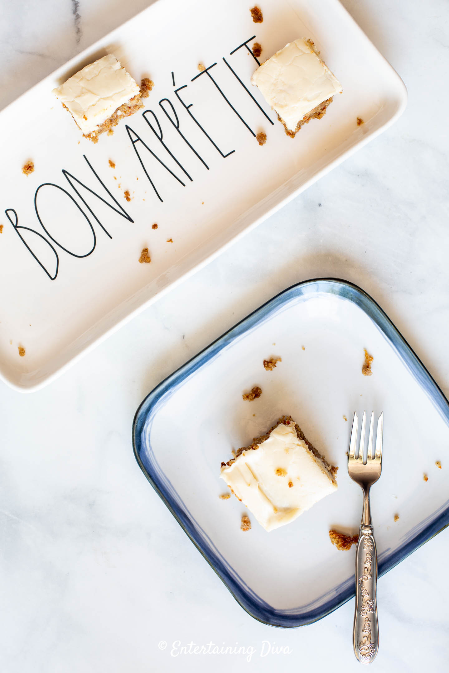 Pieces of a single layer carrot cake on square plates