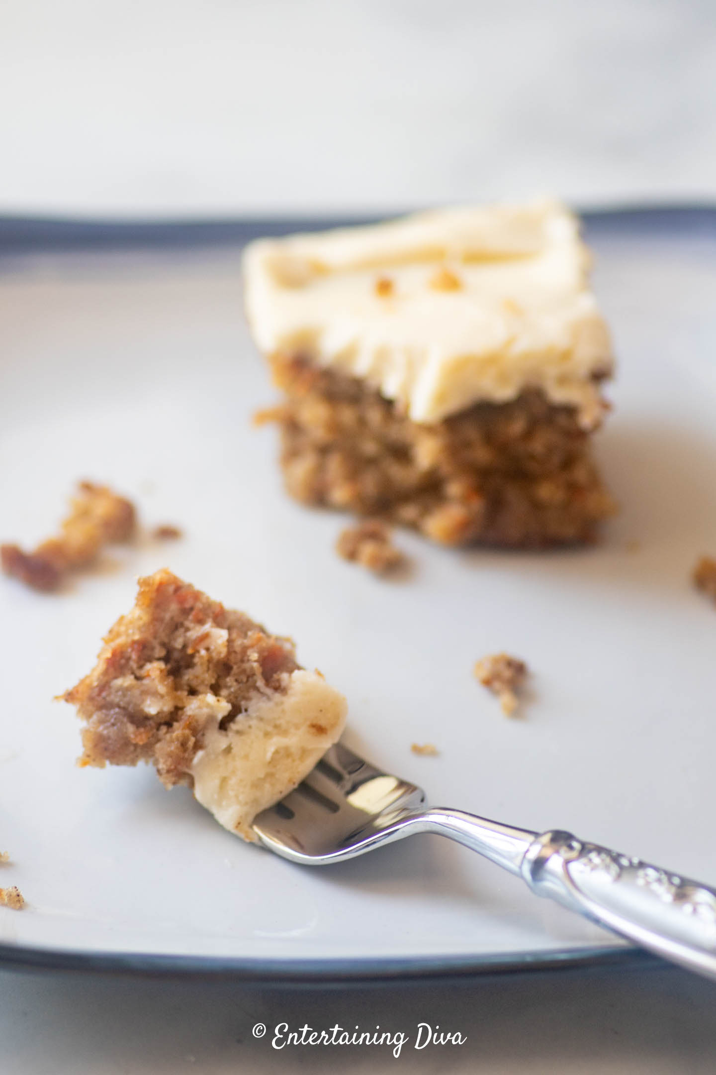 A piece of classic carrot cake on a fork