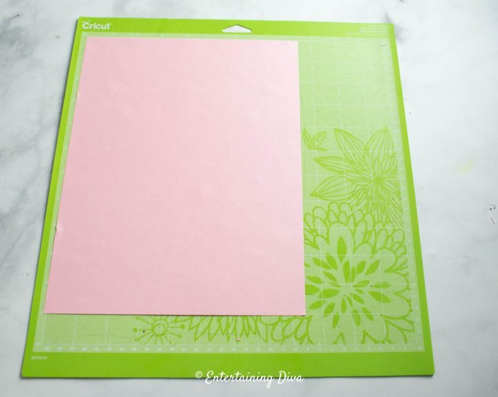 Pink paper on a cricut mat