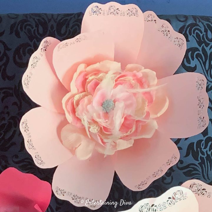 Large pink paper flower with feathered flower center