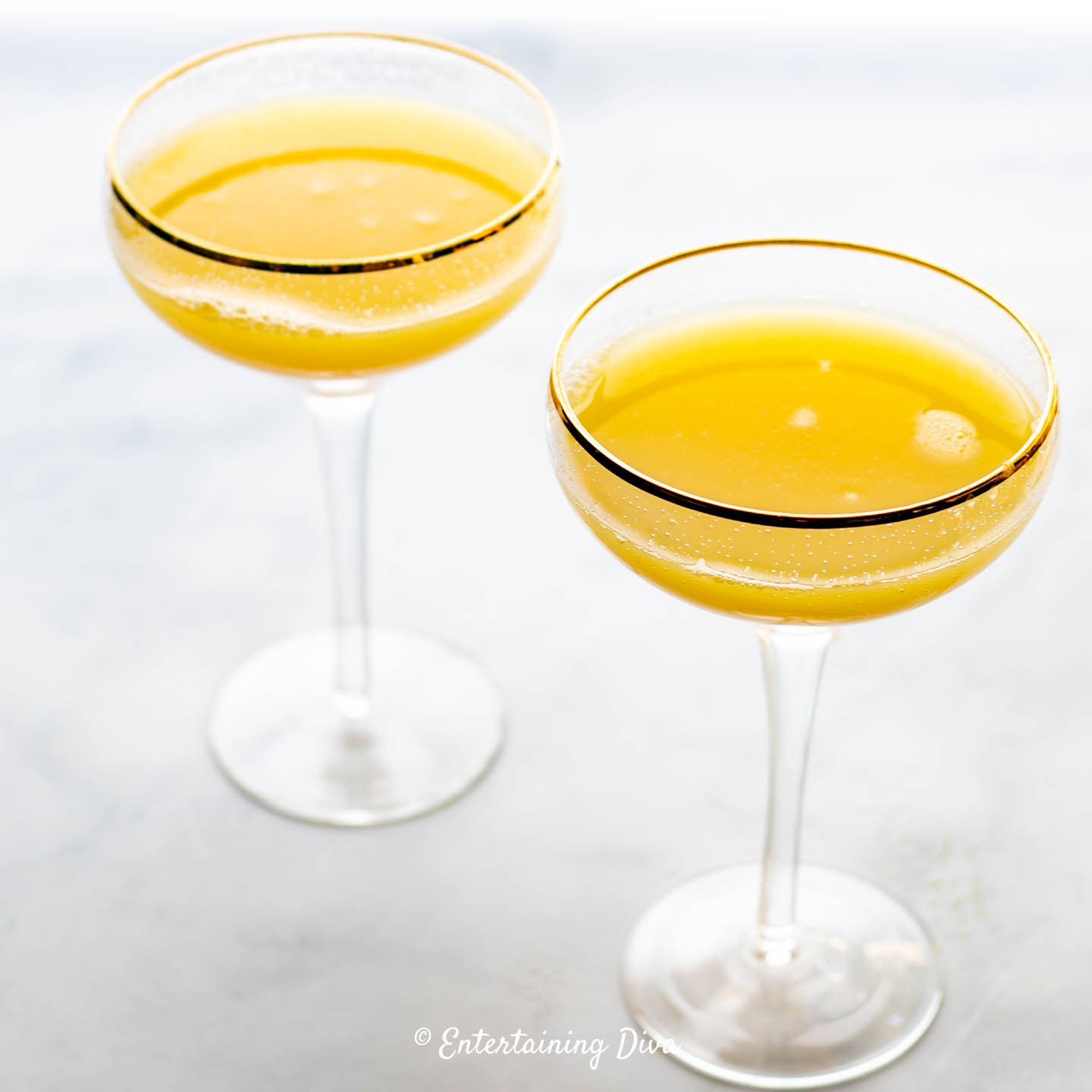 Classic mimosas in coupe glasses