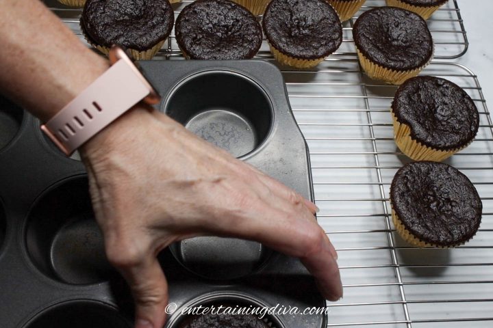 Chocolate cupcakes cooling on a wire rack