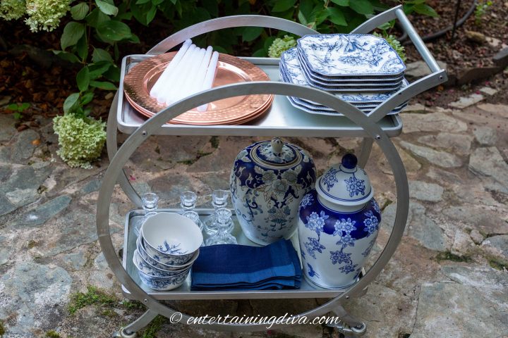 Bar cart with dishes on an outdoor patio